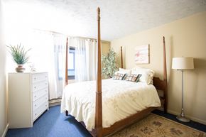 New Haven apartment for rent - a bedroom with a bed and a dresser and a window