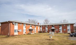 Meriden apartment for rent - the outlook of an apartment building with a parking lot