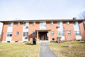Meriden apartment for rent - a brick building with a sidewalk in front of it