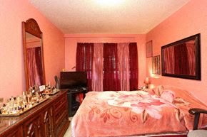 Hartford apartment for rent - a bedroom with a bed and a dresser and a mirror