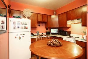 Hartford apartment for rent - a kitchen with a table and a refrigerator