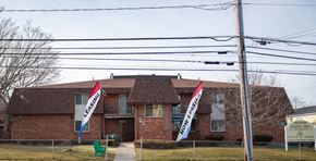 Meriden apartment for rent - a house with flags in front of it