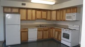 Hartford apartment for rent - an empty kitchen with white appliances and wooden cabinets