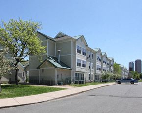 Hartford apartment for rent - a row of houses on a street with a car