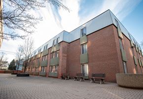 Wallingford apartment for rent - a brick building with benches in front of it