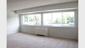 Meriden apartment for rent - an empty living room with a window and a radiator