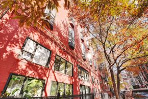 New York apartment for rent - a red building with a tree in front of it