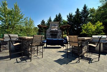 Outdoor fireplace with grilling area