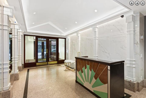 New York apartment for rent - a large lobby with a reception desk and a door