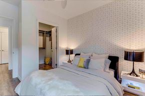 Seattle apartment for rent - a bedroom with a bed and a closet