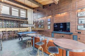 Seattle apartment for rent - a game room with a pool table and a television