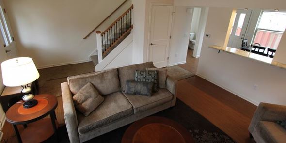 Madison townhouse for rent - a living room with a couch and a staircase