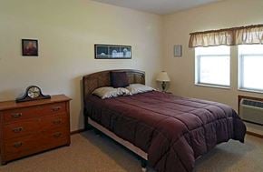 Waunakee apartment for rent - a bedroom with a bed and a dresser