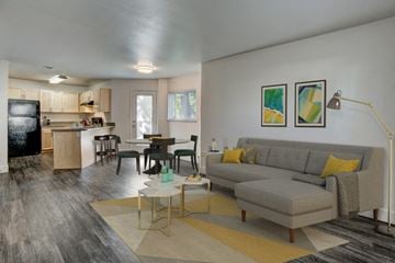 Fort Collins apartment for rent - a living room and kitchen with a couch and a table