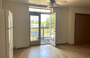 Madison apartment for rent - an empty living room with a door to a balcony