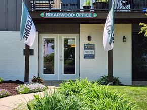 Madison apartment for rent - the front of the brahranwood office building with flags