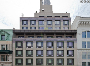 New York apartment for rent - a building with many windows and a antenna on top of it