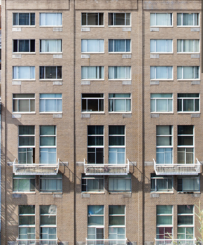 New York apartment for rent - the facade of an apartment building with windows and balconies