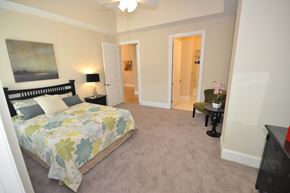 Durham apartment for rent - a bedroom with a bed and a door to a bathroom