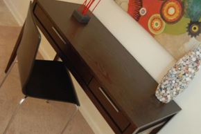 Durham apartment for rent - a wooden desk with a chair next to it