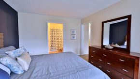 Baltimore apartment for rent - a bedroom with a large bed and a dresser