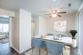 Windsor Mill townhouse for rent - a dining room with a table and a ceiling fan