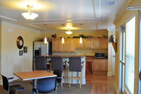 Cleveland apartment for rent - A kitchen with wooden cabinets and a table with chairs.