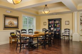 Brooksville apartment for rent - Inviting resident gathering space with classic furnishings, wood flooring, and ample seating for meals, events, or socializing.