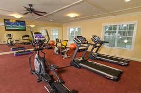 Brooksville apartment for rent - an inviting gym for residents to use weights or cardio machines.