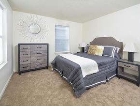 Columbus apartment for rent - A bedroom with a bed, nightstand, and dresser.