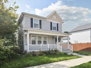 Columbus apartment for rent - A house with a grey siding and white trim.