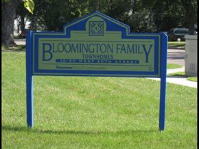 Bloomington townhouse for rent - a sign family townhomes in front of a park