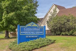 Bloomington townhouse for rent - a blue sign in front of a building