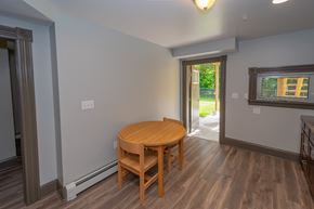 Schenectady apartment for rent - a dining room with a wooden table and chairs