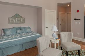 Schenectady apartment for rent - a bedroom with a bed and two chairs and a table