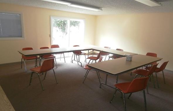 Reedport apartment for rent - a conference room with tables and chairs and a window