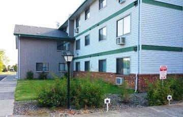 Lewiston apartment for rent - a white and green house with a street light