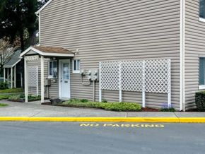 Reedsport apartment for rent - a white house with a no parking sign in front of it