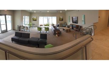 Garden City apartment for rent - a living room with a bar and furniture in it