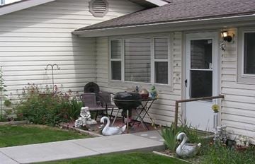 Twin Falls apartment for rent - two geese in a yard in front of a house