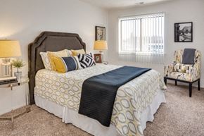 Belleville apartment for rent - A bedroom with a large bed and a chair.