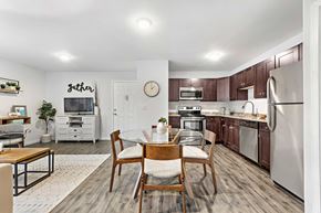 Plainsboro Township apartment for rent - a kitchen with stainless steel appliances and a dining table