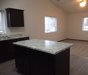 Belle Plaine townhouse for rent - an empty kitchen with a granite counter top