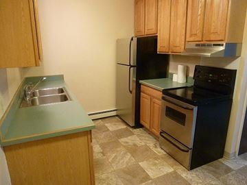 Bridger apartment for rent - a small kitchen with a sink and a refrigerator