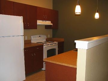 Missoula apartment for rent - a kitchen with a stove and a refrigerator