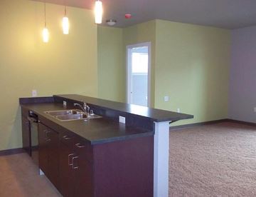 Missoula apartment for rent - an empty room with a kitchen with a sink