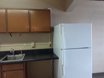 Great Falls apartment for rent - a kitchen with a sink and a refrigerator