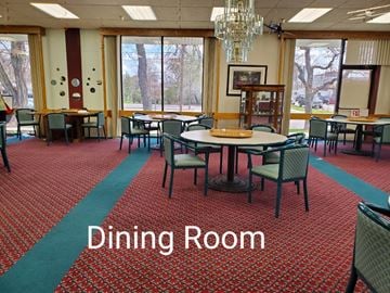 Billings apartment for rent - a dining room with tables and chairs and a chandelier