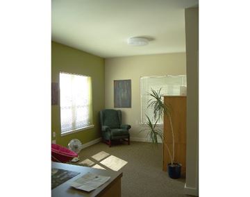 Billings apartment for rent - a living room with a chair and a plant
