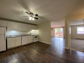 Milford apartment for rent - A kitchen with white cabinets and a ceiling fan.